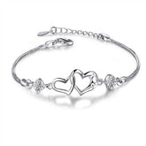 Pulseira de prata esterlina 925 com pingente de coração em cristal, delicada e sofisticada.
