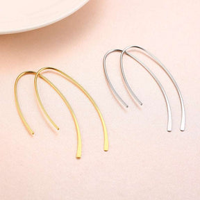 Brincos de argola geométricos minimalistas em aço inoxidável dourado ou prateado, design elegante e sofisticado para mulheres modernas.