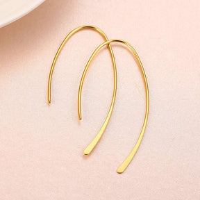Brincos de argola geométricos minimalistas em aço inoxidável dourado ou prateado, design elegante e sofisticado para mulheres modernas.