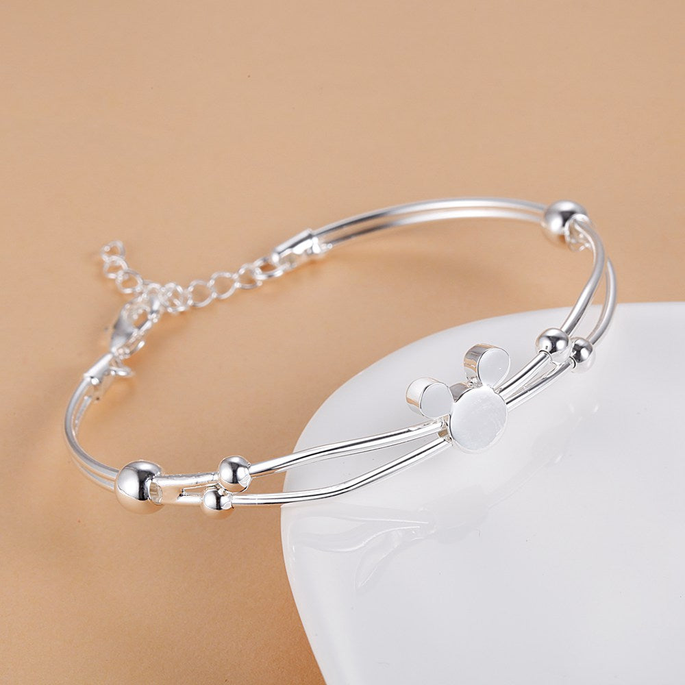 Pulseira Mickey Verzano®, Prata Esterlina 925, design clássico e sofisticado, joia delicada e ajustável, ideal para casamentos e eventos especiais.