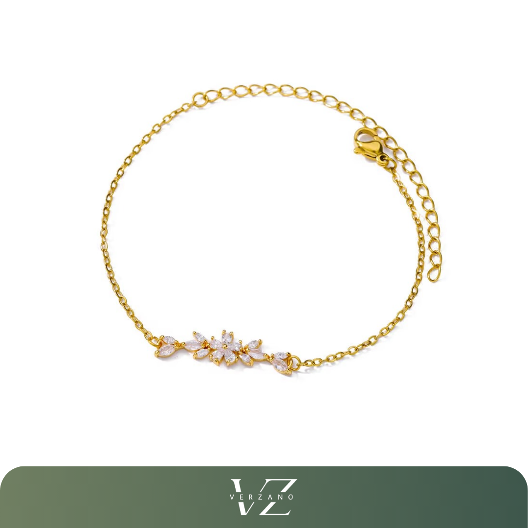 Pulseira Verzano® com flores de zircônia e corrente dourada em aço inoxidável, design delicado e ajustável — joia elegante para festas e ocasiões especiais.

