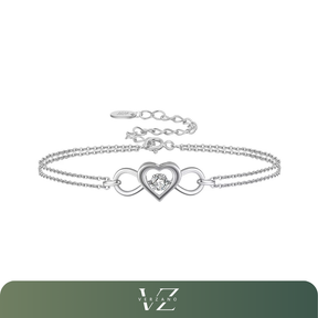 Pulseira Verzano® em prata esterlina 925 com coração e símbolo do infinito entrelaçados, zircônia brilhante central, corrente fina ajustável — disponível em três cores elegantes.

